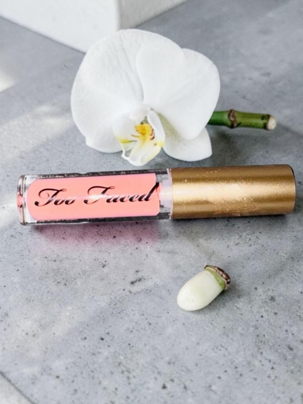 Too Faced Pink Lip Gloss with Gold Cap
Travel size